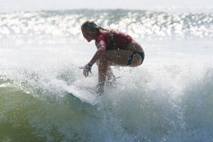 young surfing girl