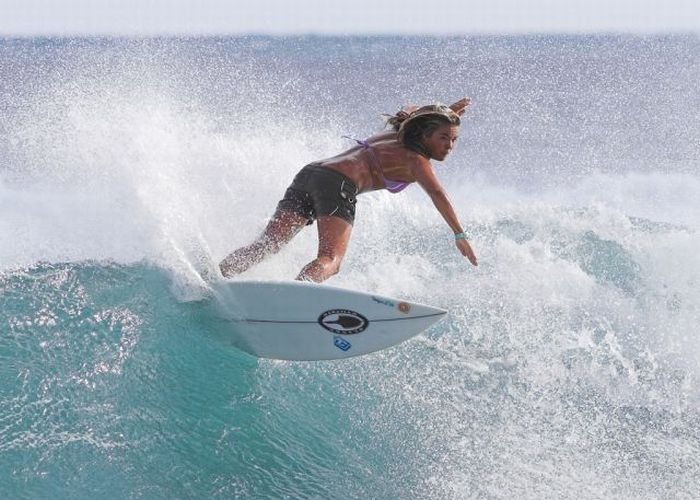 young surfing girl