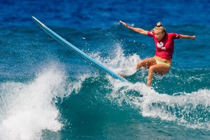 young surfing girl