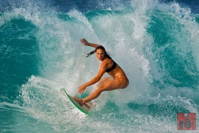 young surfing girl