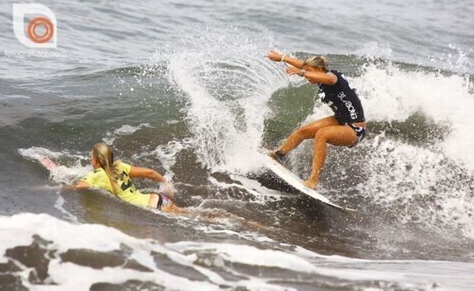 young surfing girl