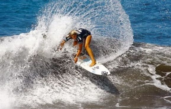 young surfing girl