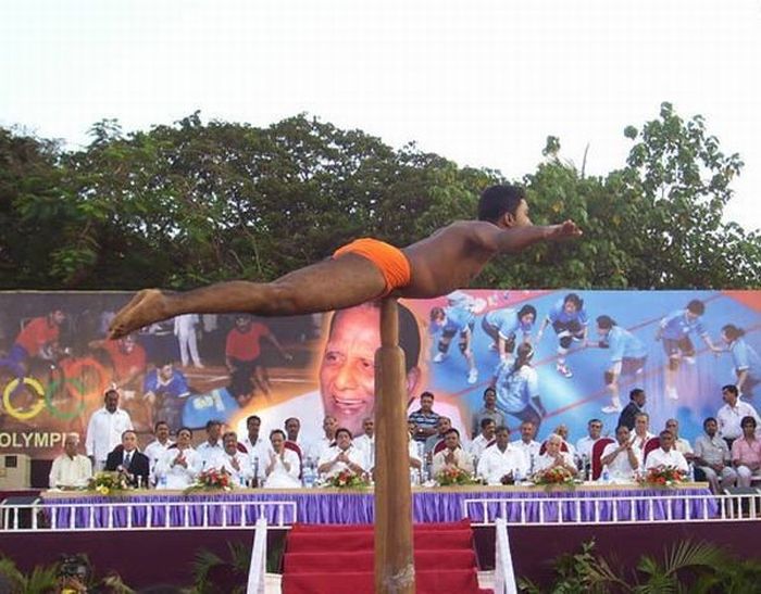 Mallakhamb, Asana  (yoga) on a pole