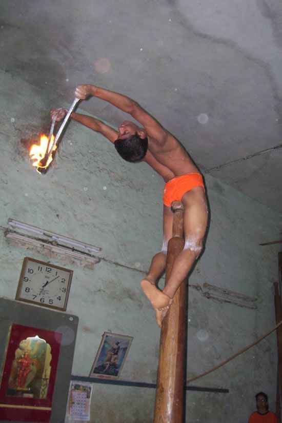 Mallakhamb, Asana  (yoga) on a pole