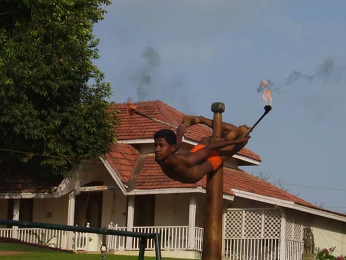 Mallakhamb, Asana  (yoga) on a pole