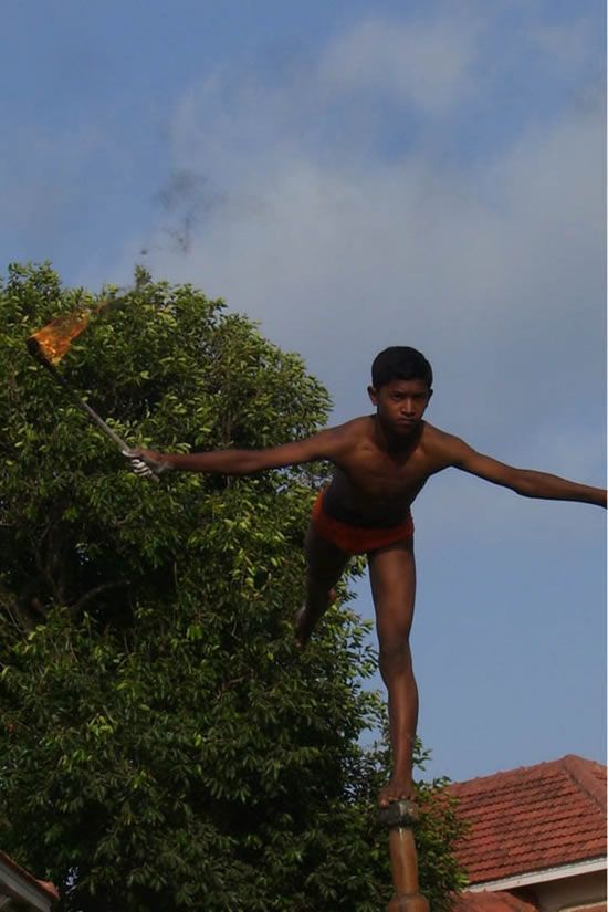 Mallakhamb, Asana  (yoga) on a pole