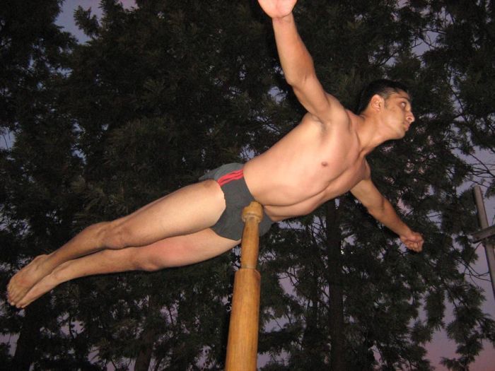 Mallakhamb, Asana  (yoga) on a pole