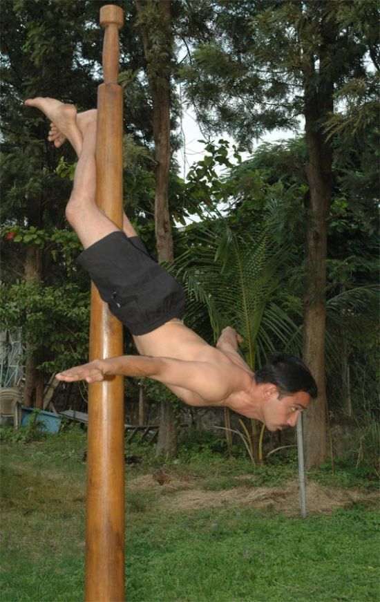 Mallakhamb, Asana  (yoga) on a pole