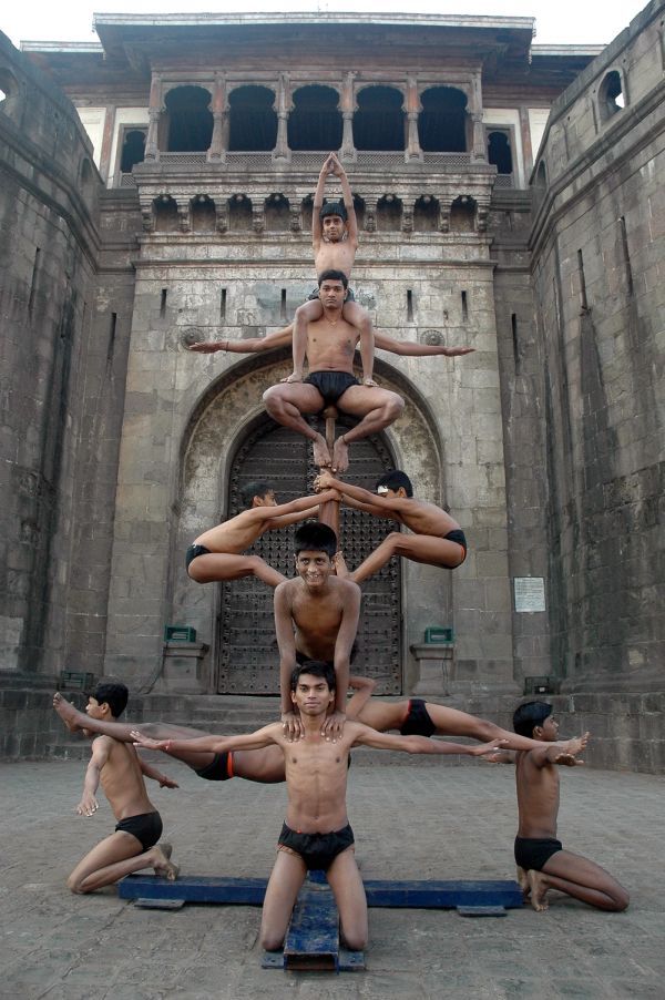 Mallakhamb, Asana  (yoga) on a pole