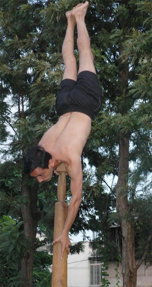 Mallakhamb, Asana  (yoga) on a pole