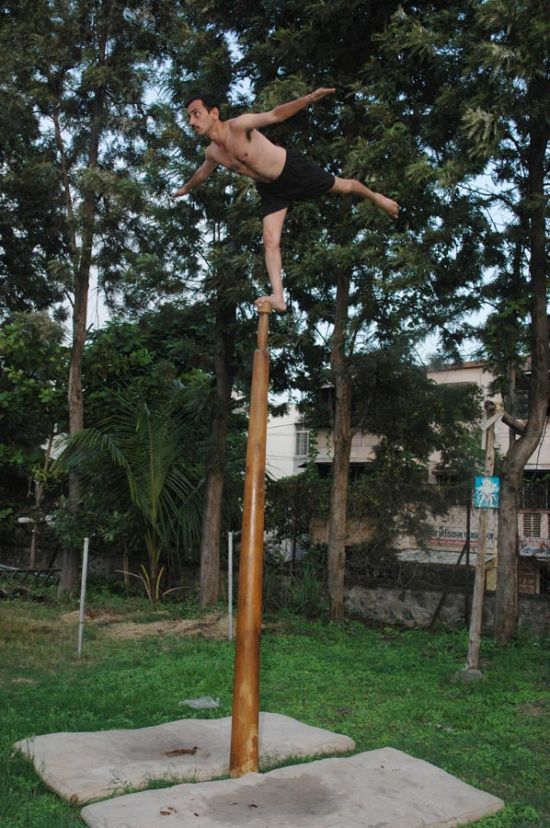 Mallakhamb, Asana  (yoga) on a pole