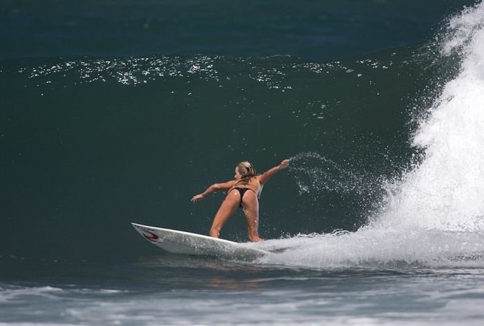 young surfing girl