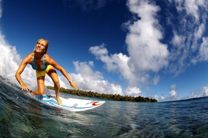 young surfing girl