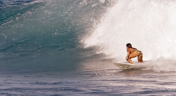 young surfing girl