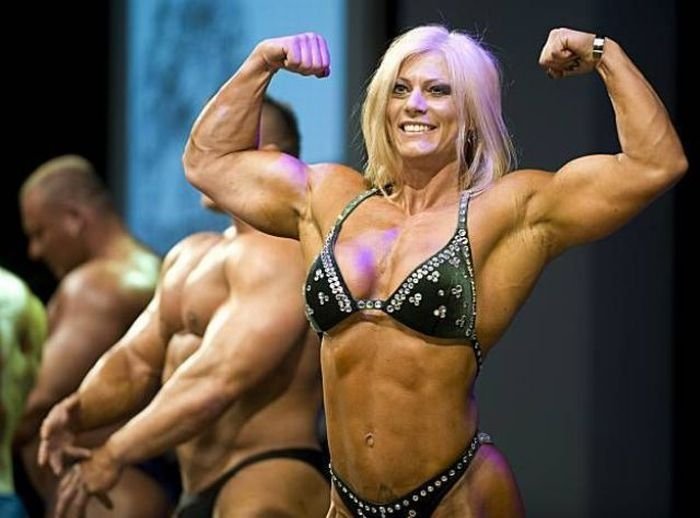 strong fitness bodybuilding girl with abdominal six-pack belly muscles