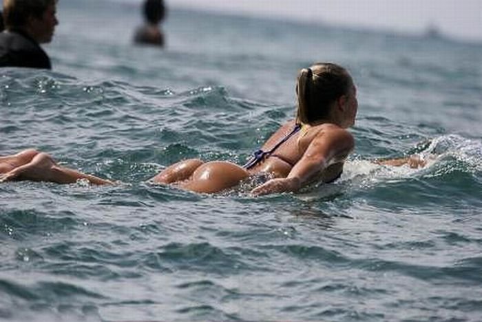 young surfing girl