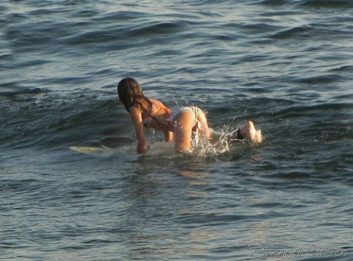 young surfing girl