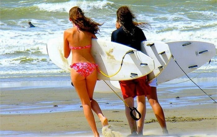 young surfing girl