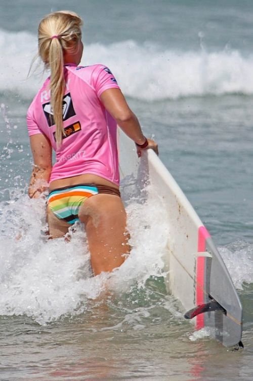 young surfing girl