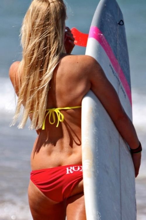 young surfing girl