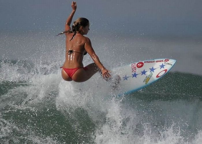 young surfing girl