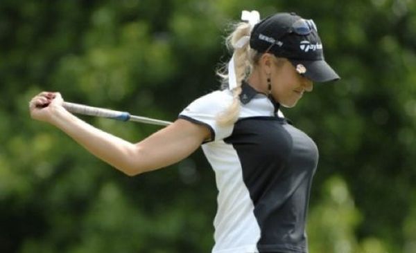 girl playing golf