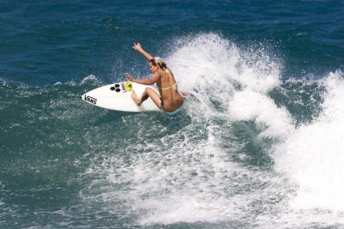 young surfing girl