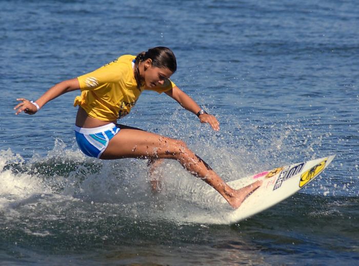 young surfing girl