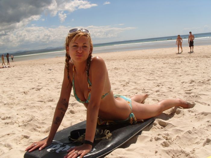 young surfing girl