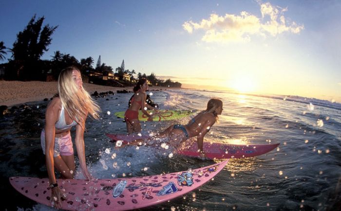 young surfing girl