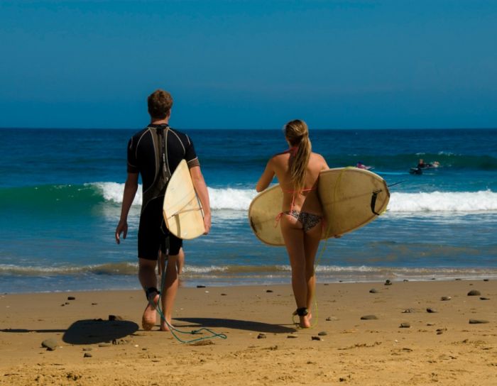 young surfing girl