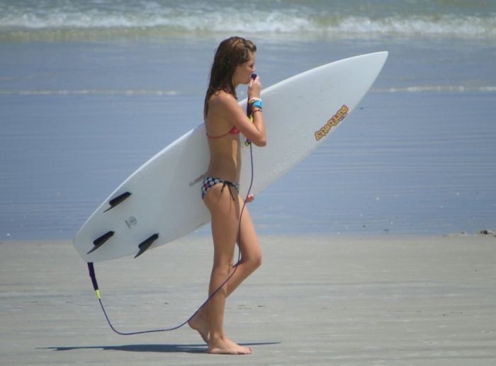 young surfing girl