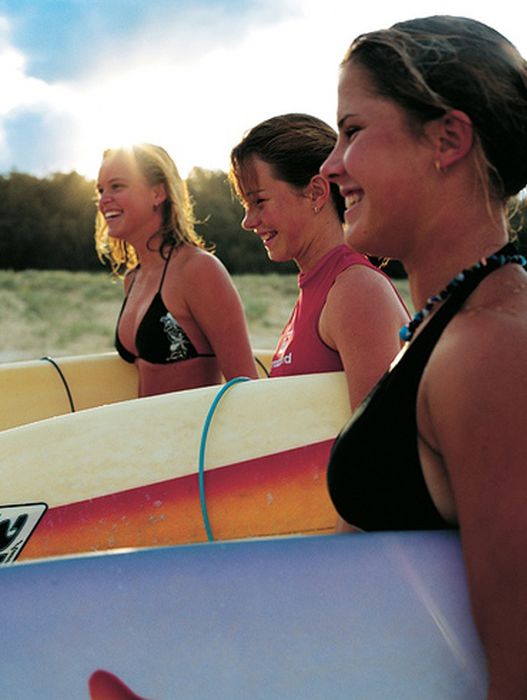 young surfing girl