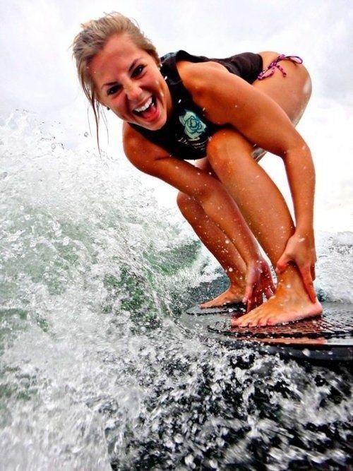 young surfing girl