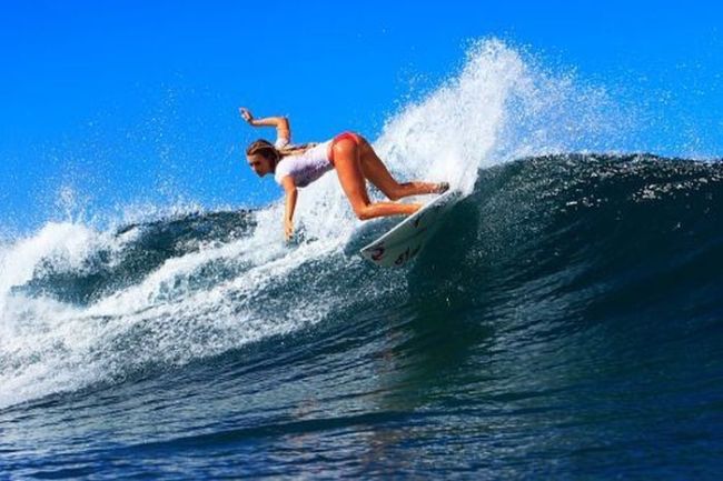 young surfing girl