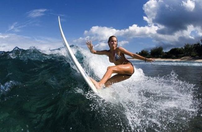 young surfing girl