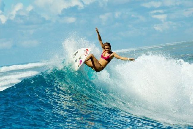 young surfing girl