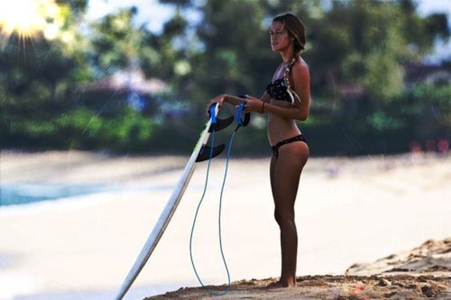 young surfing girl