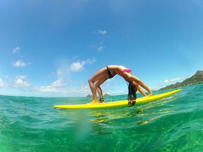 young surfing girl