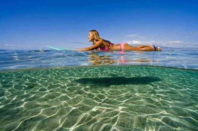 young surfing girl