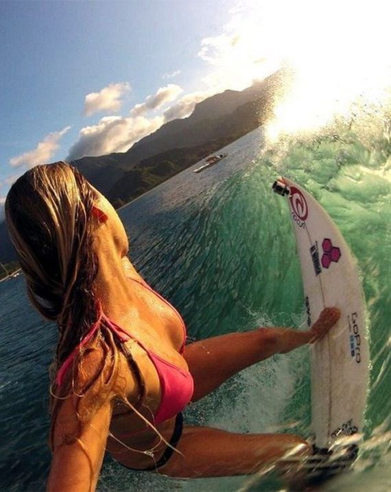 young surfing girl