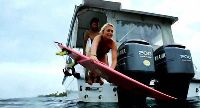 young surfing girl