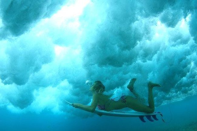 young surfing girl