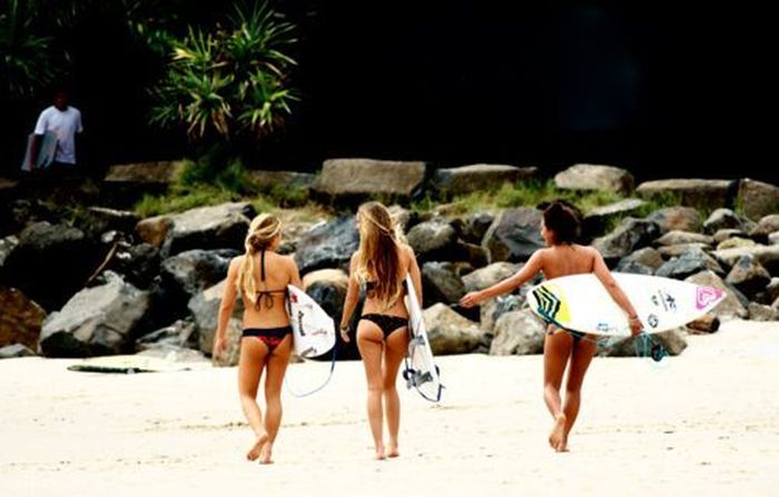 young surfing girl