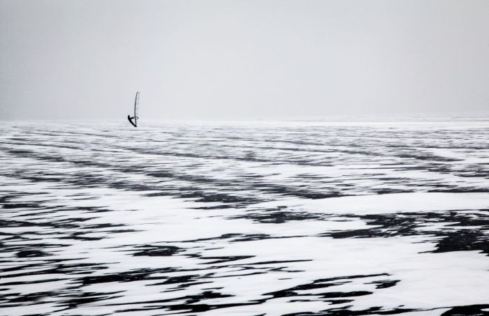 ice windsurfing on a frozen lake