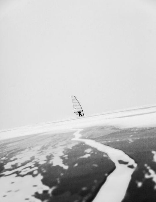 ice windsurfing on a frozen lake