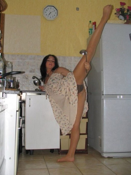 young brunette girl doing flexible gymnastics at home