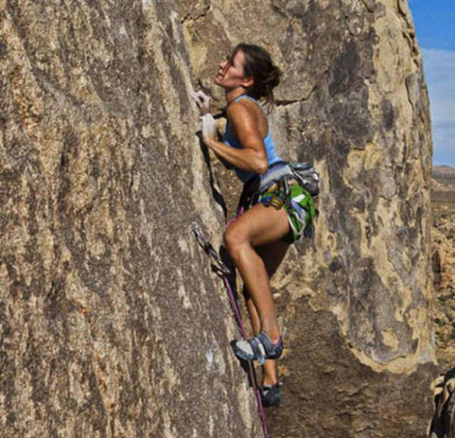 young rock climbing girl