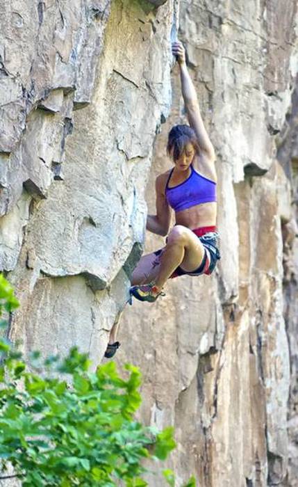 young rock climbing girl