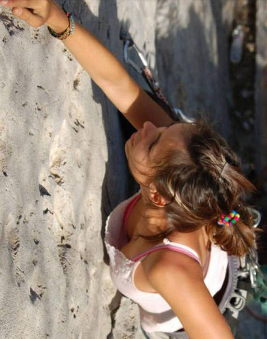 young rock climbing girl